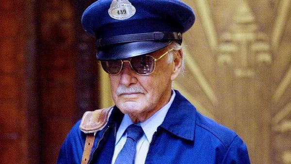Stan Lee dressed as a mailman from the movie, Fantastic Four